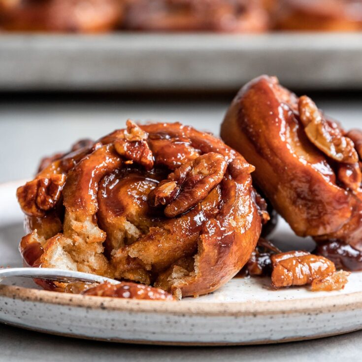 carrot cake sticky buns with a bite taken out
