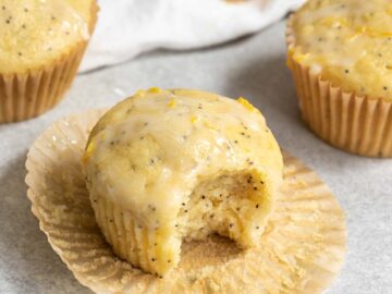 a lemon poppyseed muffin with a bite taken out