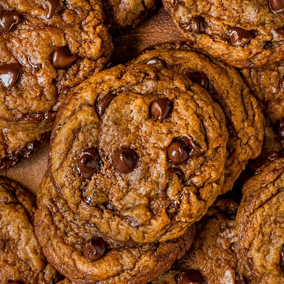 close up overhead shot of pile of pumpkin chocolate chip cookies