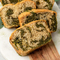 slices of matcha vanilla marble bread on a board