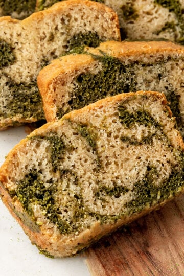 slices of matcha vanilla marble bread on a board