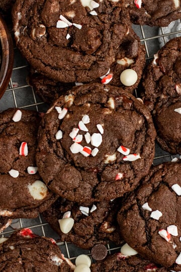 wire rack of chocolate cookies with peppermint, white chocolate, dark chocolate chips
