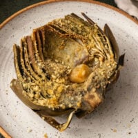 roasted garlic artichoke half on a plate