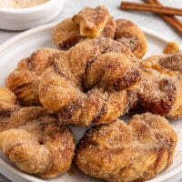 plate with stacked cinnamon sugar knots.