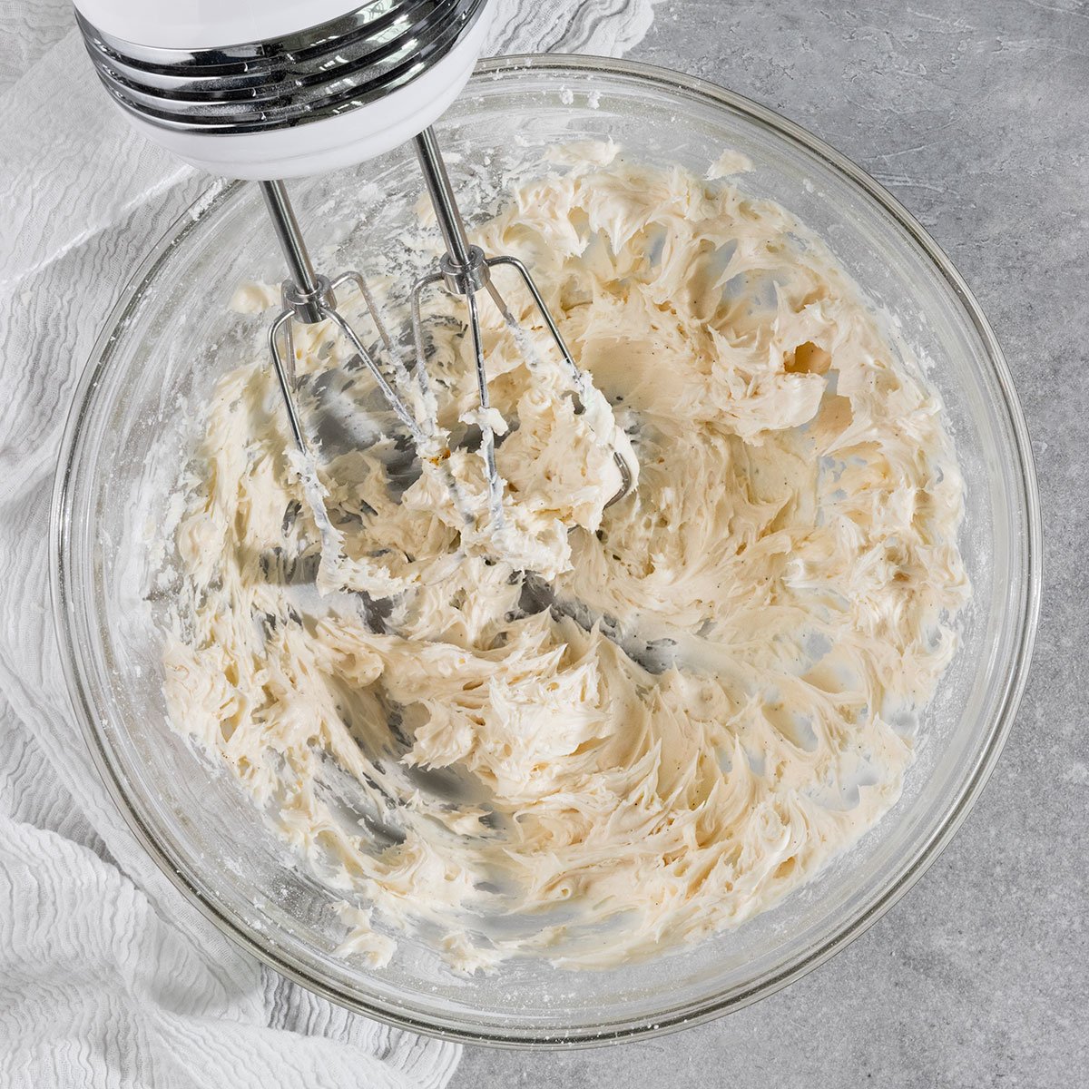 creamed butter and powdered sugar in a mixing bowl.