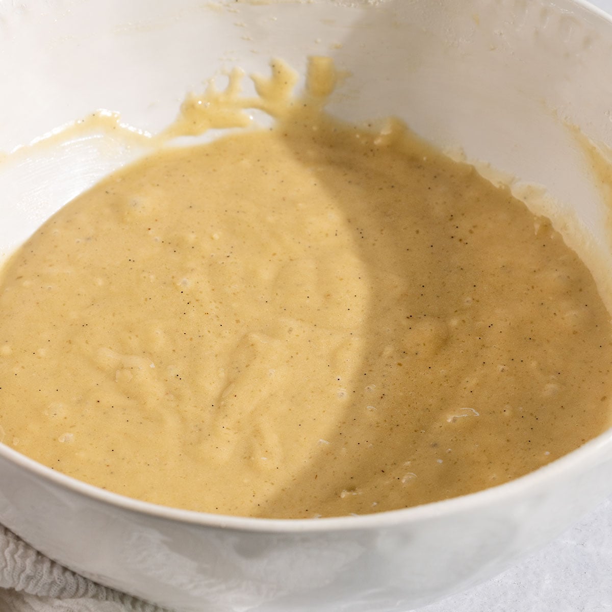 mixing bowl full of earl grey cupcake batter.