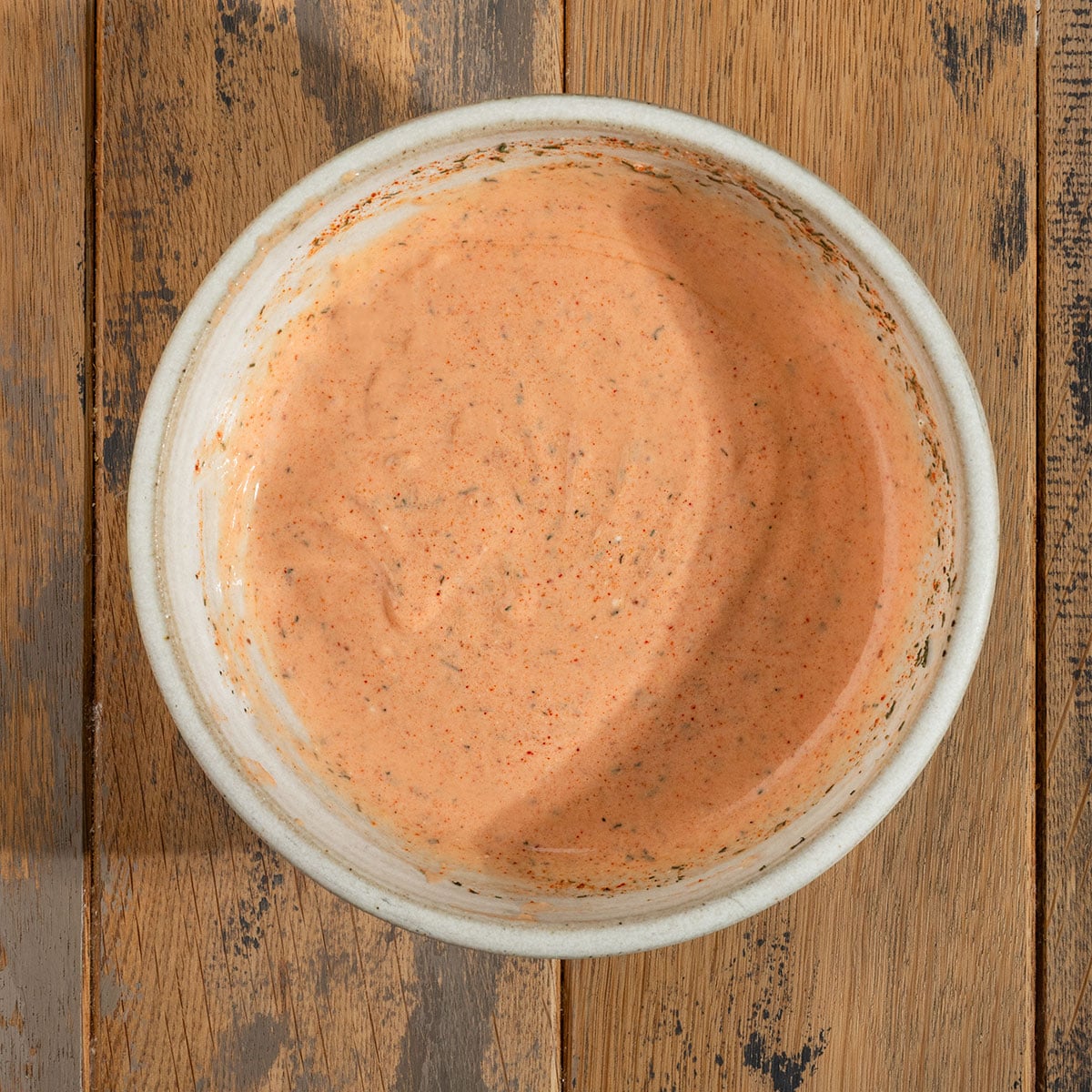 bowl of orange burger sauce.