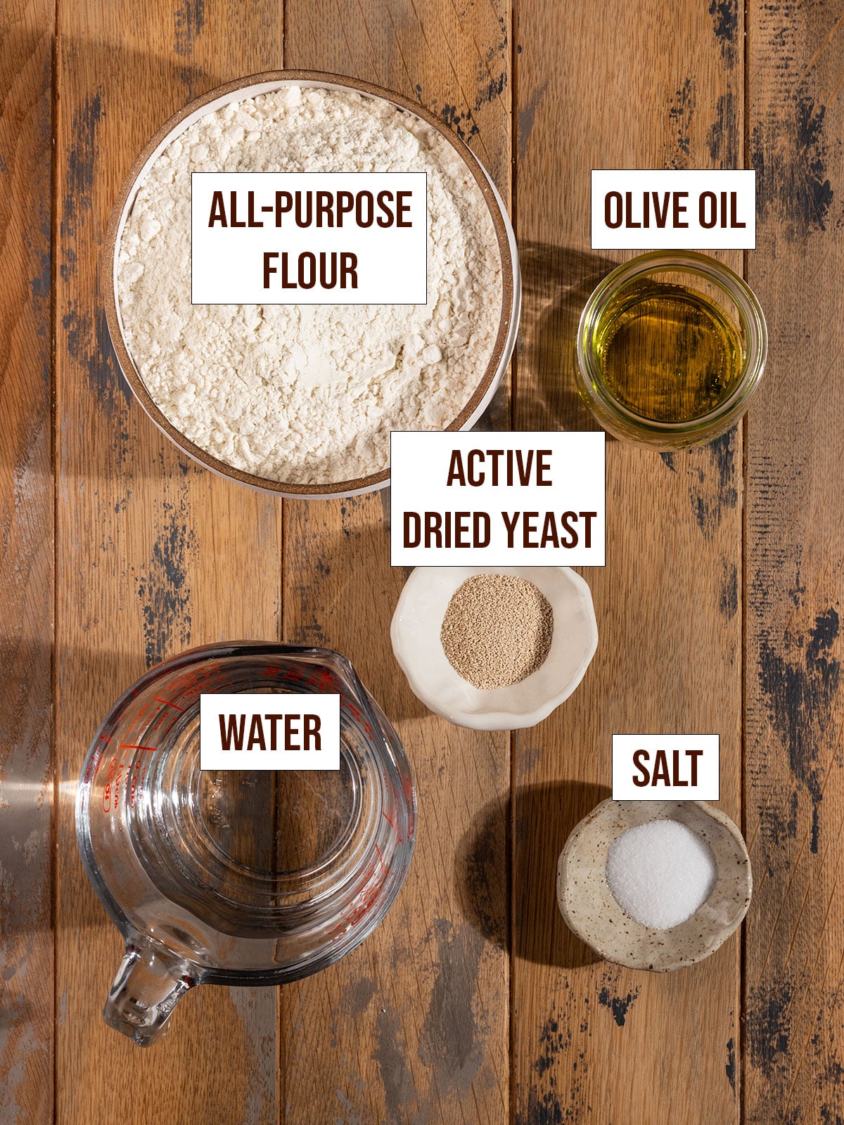 labeled ingredients including all-purpose flour, water, olive oil, yeast, and salt.