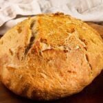loaf of bread with text overlay "rustic artisan bread recipe, only 5 ingredients!".