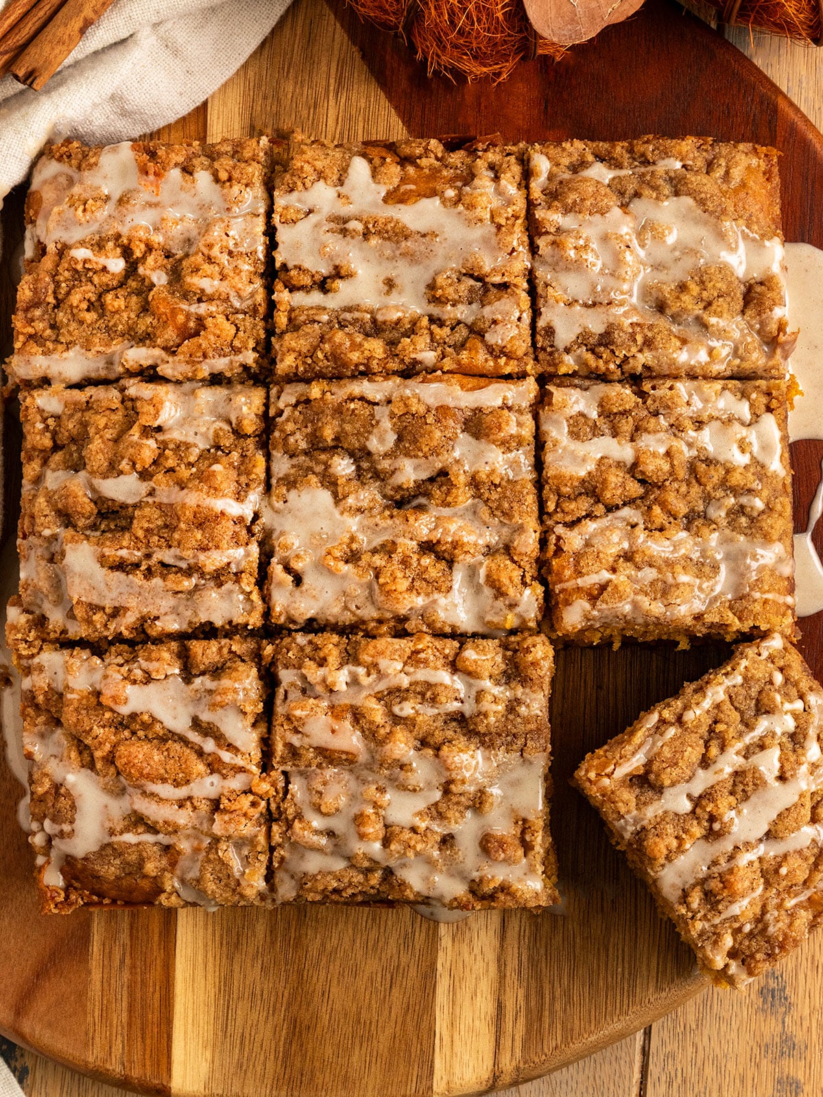 overhead shot of coffee cake sliced into squares topped with icing.