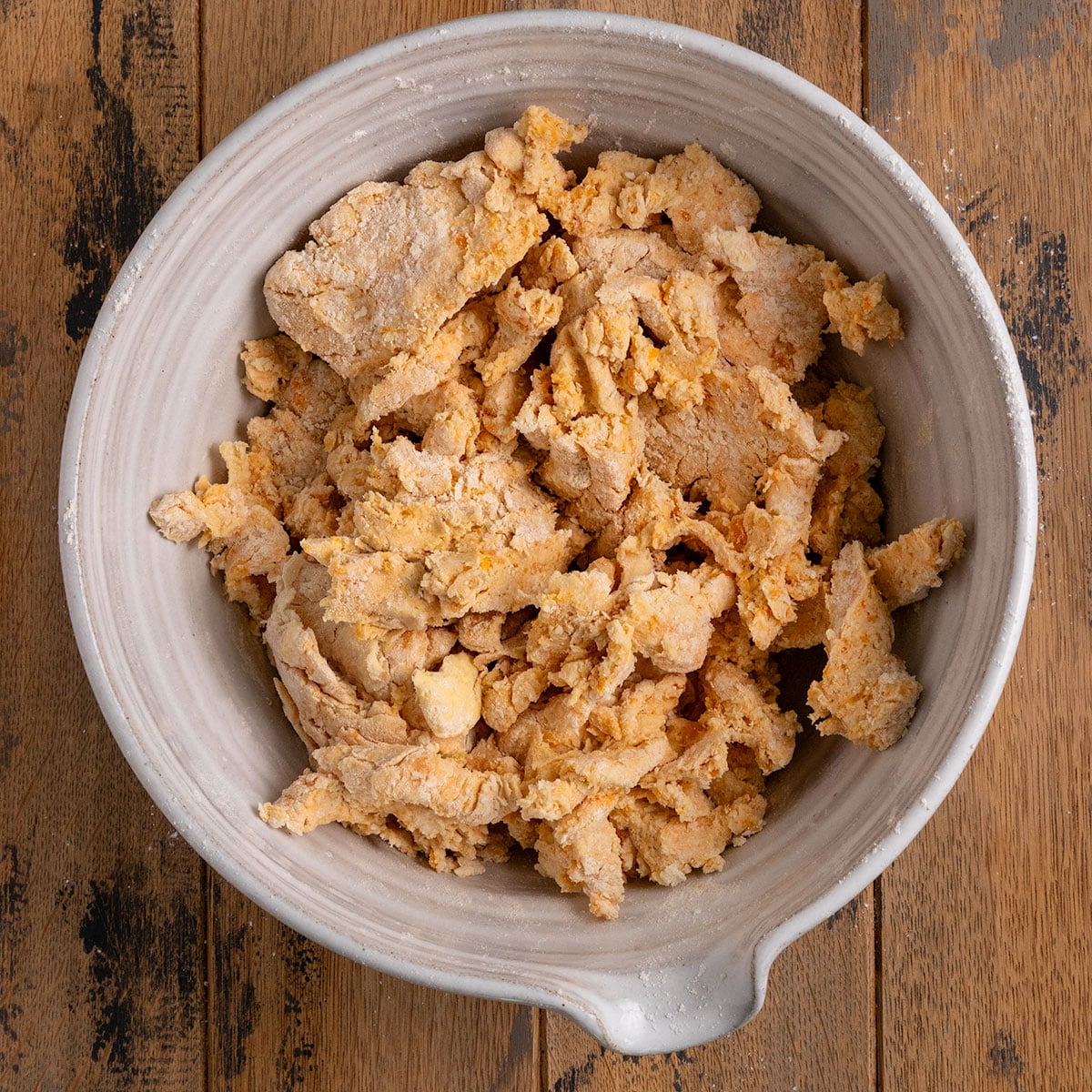 bowl of shaggy sweet potto biscuit dough.